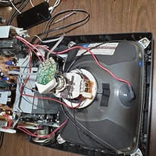 Interior of an older CRT television with the picture tube visible