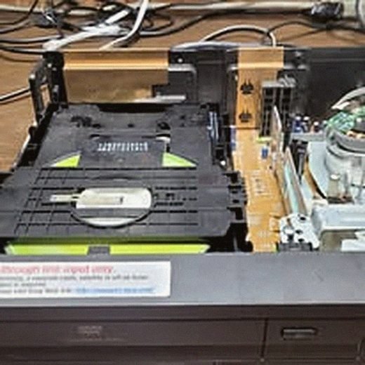 Optical disc mechanism from the DVD/VHS combo player repair